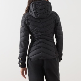 Model wearing Barbour International Salengro Quilted Jacket in black, back view, showing chevron quilting and stretch side panels, styled with black