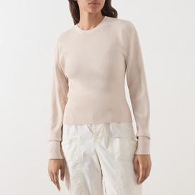 Model wearing Barbour International Cyrus Dropped-Shoulder Sweater in Nutmeg, ribbed cotton knit with round neck and cinched cuffs, styled with white