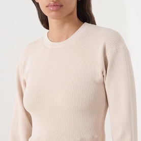 Model wearing Barbour International Cyrus Dropped-Shoulder Sweater in Nutmeg, ribbed knit with round neck and balloon sleeves.