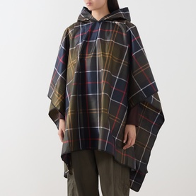 Model wearing Barbour poncho in multi tartan check with hood, styled with khaki trousers
