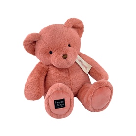 Dou Dou pink plush teddy bear, seated pose with soft fluffy texture and brand label on foot