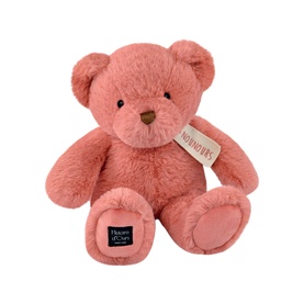 Dou Dou pink plush teddy bear, seated pose with soft fluffy fur, small label tag, and embroidered facial features