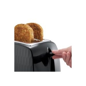 Russell Hobbs Honeycomb 2 Slice Toaster in black with textured honeycomb body, toasting bread, hand pressing cancel lever.