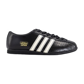 Adidas Japan trainer in core black and cream white, leather upper with three stripes, gold branding, lace-up fastening, black sole