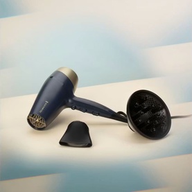 Remington Sapphire Luxe Hair Dryer in Deep Navy and Champagne, shown with diffuser and concentrator nozzle attachments