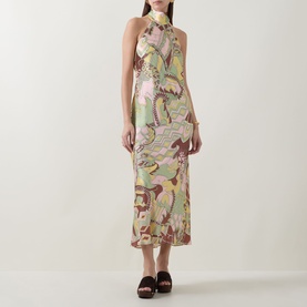 Model wearing Rixo Maura Bianca Abstract Dress in Bianca Abstract Green, halterneck midi length with wide neckband, styled with black mule sandals