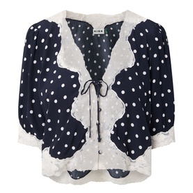 Rixo top in Layla Dot Navy, white polka dot viscose with scalloped lace trim, tie-front detail and short sleeves