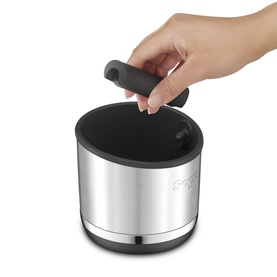 Hand lifting the lid of a stainless steel insulated food container with black handle and base