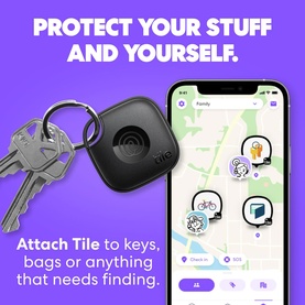 Tile Mate black Bluetooth tracker attached to a keyring, shown alongside a smartphone displaying the Tile tracking app map interface.