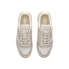 Axel Arigato white low-top trainers, overhead view, suede and leather upper, cream sole with yellow heel accent detail.