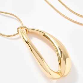 Gold-tone long snake chain necklace with large polished open teardrop twisted pendant