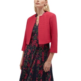 Model wearing Hobbs mulberry pink boucle cropped jacket with scalloped hem, styled over a floral print midi dress