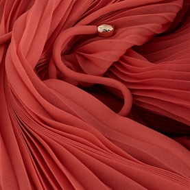 Phase Eight red pleated dress fabric detail with gold-tone button fastening