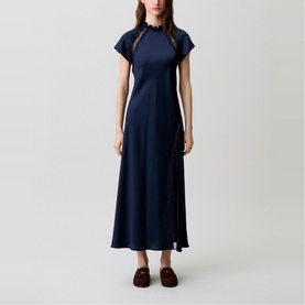 Model wearing Claude Pierlot Womens French Dress in blue, midi length, cap sleeves, high neck, styled with dark brown loafers.