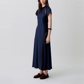 Model wearing Claude Pierlot Womens French Dress in blue, midi length with short sleeves and lace trim detail, styled with brown loafers