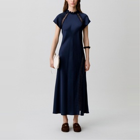 Model wearing Claude Pierlot Womens French Dress in blue, maxi length with cap sleeves and high neck, styled with white bag and brown loafers