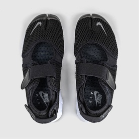 Nike Air Rift trainers in black mesh with split-toe design, adjustable strap, and white sole, overhead view