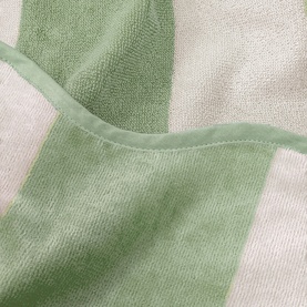 Allure Scallop Beach Towel in green and white wide stripes, 100% cotton jacquard fabric, close-up showing texture and hemmed edge.
