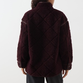 Model wearing Barbour Maplewood Fleece Jacket in Fig/Ganache, showing quilted-effect back, stand-up collar and contrast trim detail.