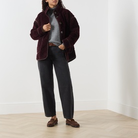 Model wearing Barbour Maplewood Fleece Jacket in Fig/Ganache, styled with grey roll-neck, dark trousers and brown loafers