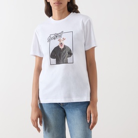 Model wearing Barbour Mariana Dog T-Shirt in white with dog photo print, styled with blue jeans.