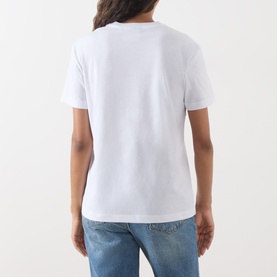 Model wearing Barbour Mariana Dog T-Shirt in white, back view, short sleeves, round neck, styled with blue jeans.