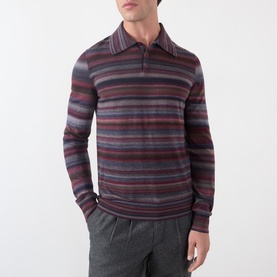 Model wearing Dolce & Gabbana blue striped wool polo shirt with burgundy and grey horizontal stripes, paired with grey trousers