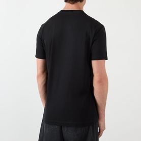 Model wearing Dolce & Gabbana Logo Tab T-Shirt in black, rear view, showing regular fit short sleeve crew neck style in cotton.