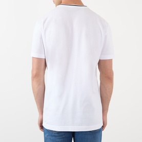 Model wearing Dolce & Gabbana Tipped Logo T-Shirt in Optical White, rear view showing short sleeves and straight hemline.