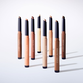 Est&eacute;e Lauder The Essential Eyeshadow Stick in Latte, shown in a group of eight nude and brown shades in twist-up pencil format
