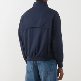 Model wearing Farah Vintage True Navy casual jacket, rear view, ribbed hem and cuffs, back chest pocket, styled with light blue jeans