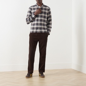 Model wearing Farah Vintage Dark Brown check cotton casual shirt with brown corduroy trousers and brown leather shoes.