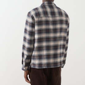Model wearing Farah Vintage Dark Brown check casual shirt in 100% cotton, rear view, styled with brown corduroy trousers.