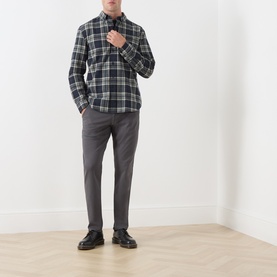 Model wearing Farah Vintage Casual Shirt in Rosemary green plaid check, paired with grey trousers and black leather shoes