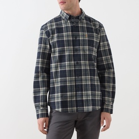 Model wearing Farah Vintage Casual Shirt in Rosemary, navy and green tartan check, button-down collar, paired with grey trousers