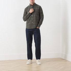 Model wearing Farah Vintage Casual Shirt in Rosemary green check, styled with dark navy jeans and white trainers