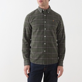 Model wearing Farah Vintage Casual Shirt in Rosemary green windowpane check, long sleeves, button-down collar, styled with dark navy jeans