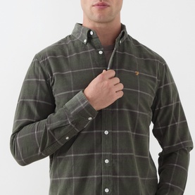 Model wearing Farah Vintage Casual Shirt in Rosemary green, large windowpane check, button-down collar, small orange logo embroidery on chest.