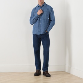 Model wearing Farah Vintage Mid Indigo casual shirt in 100% cotton, styled with navy trousers and dark brown shoes.