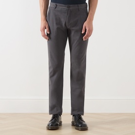 Model wearing Farah Vintage Charcoal Chino trousers in slim fit with dark leather shoes.