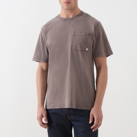Model wearing Farah Vintage Dark Brown crew neck cotton T-shirt with chest pocket, styled with dark blue jeans.