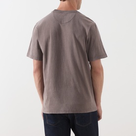 Model wearing Farah Vintage Dark Brown Crew Neck T-shirt, rear view, styled with dark navy jeans.