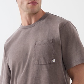 Model wearing Farah Vintage Crew Neck T in dark brown, 100% cotton with short sleeves and a single chest pocket.