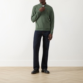 Model wearing Farah Vintage Rosemary Marl cotton half-zip sweatshirt with dark indigo jeans and black leather shoes.