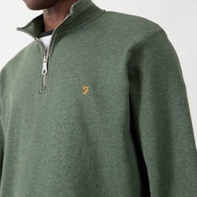 Model wearing Farah Vintage Rosemary Marl cotton half-zip sweatshirt with silver zip and embroidered logo chest detail.