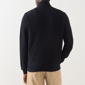 Model wearing Farah Vintage Navy Half Zip sweat, back view, 100% cotton, styled with beige trousers