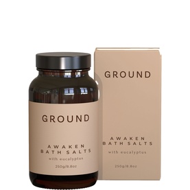 Ground Wellbeing Awaken Bath Salts with eucalyptus, 250g amber glass jar shown alongside kraft-toned rectangular box