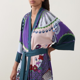 Model wearing Mey Mystic Jade Kimono in patchwork floral and geometric print with teal belt and wide sleeves