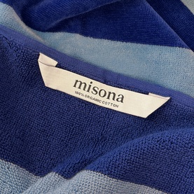 Misona Beach Towel Navy Sky in navy and sky blue stripe, 100% organic cotton label visible, close-up texture detail