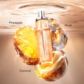 Mugler Body Mist bottle surrounded by pineapple, coconut and ice, with pineapple, musk and coconut scent notes labelled